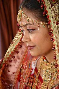 Close-up of smiling young bride at home 