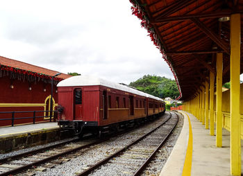 Train on railroad track against sky