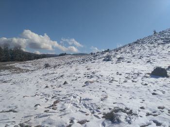 Scenic view of snowcapped mountains against sky