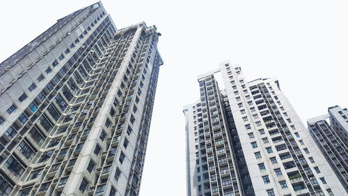 Low angle view of modern buildings against clear sky