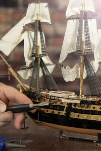 Model ship building handcraft on table with different materials