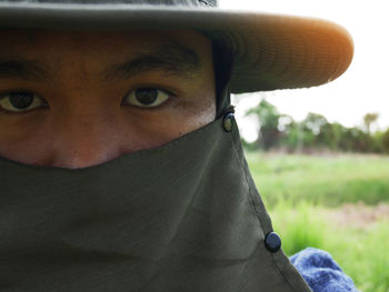 Close-up portrait of man wearing mask