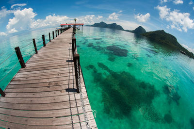 Pier over sea against sky