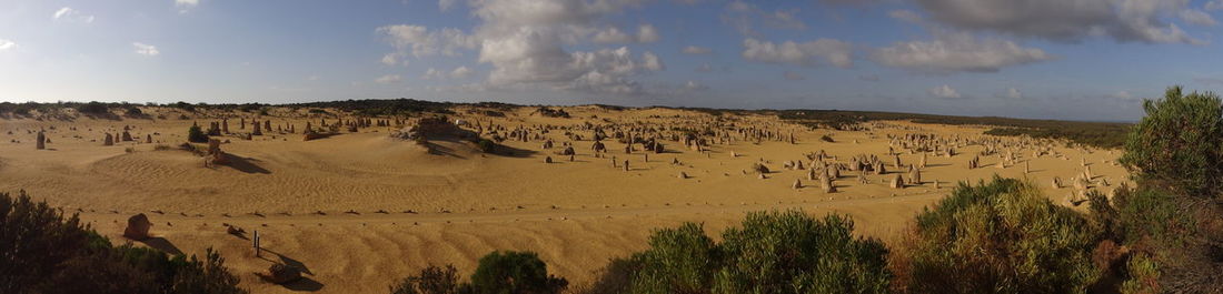 Panoramic view of desert against sky