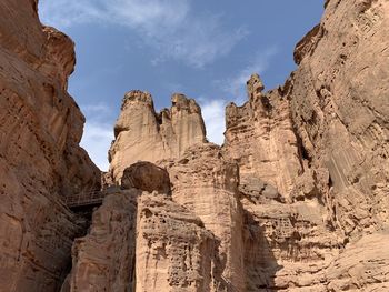 Low angle view of rocks against sky