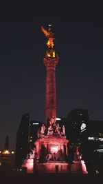 Low angle view of monument at night