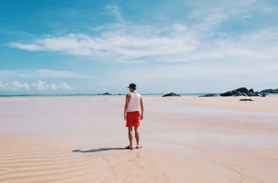 Woman walking on beach