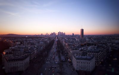 High angle view of city buildings during sunset