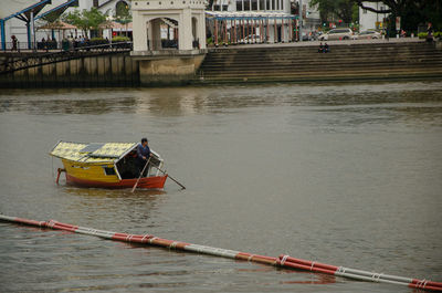 People on boat in river