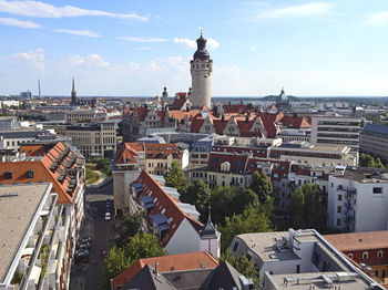 Buildings in town against sky