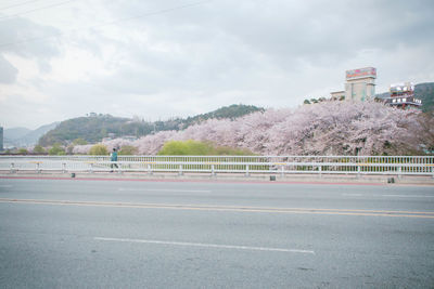 View of empty road against cloudy sky