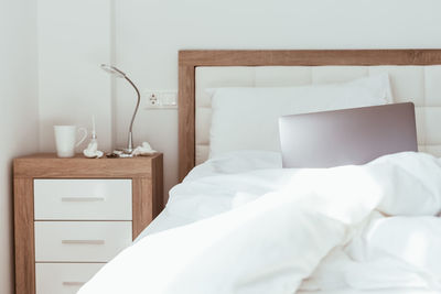 White sofa on bed at home