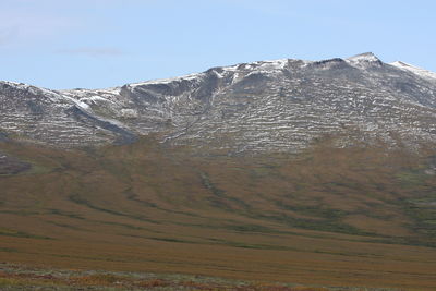 Scenic view of snowcapped mountains against clear sky