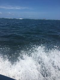 Scenic view of sea against blue sky