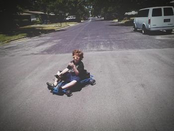 Man riding bicycle on road