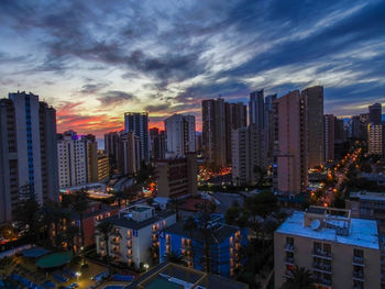 High angle view of buildings against sky during sunset