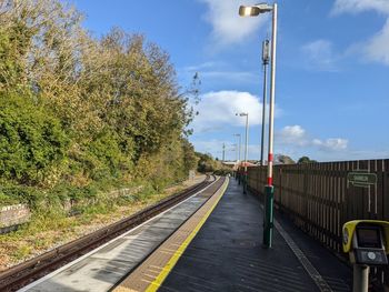 Train on railroad track against sky