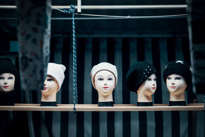 Mannequins wearing knit hats in store