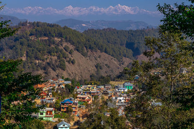 High angle view of townscape and mountains