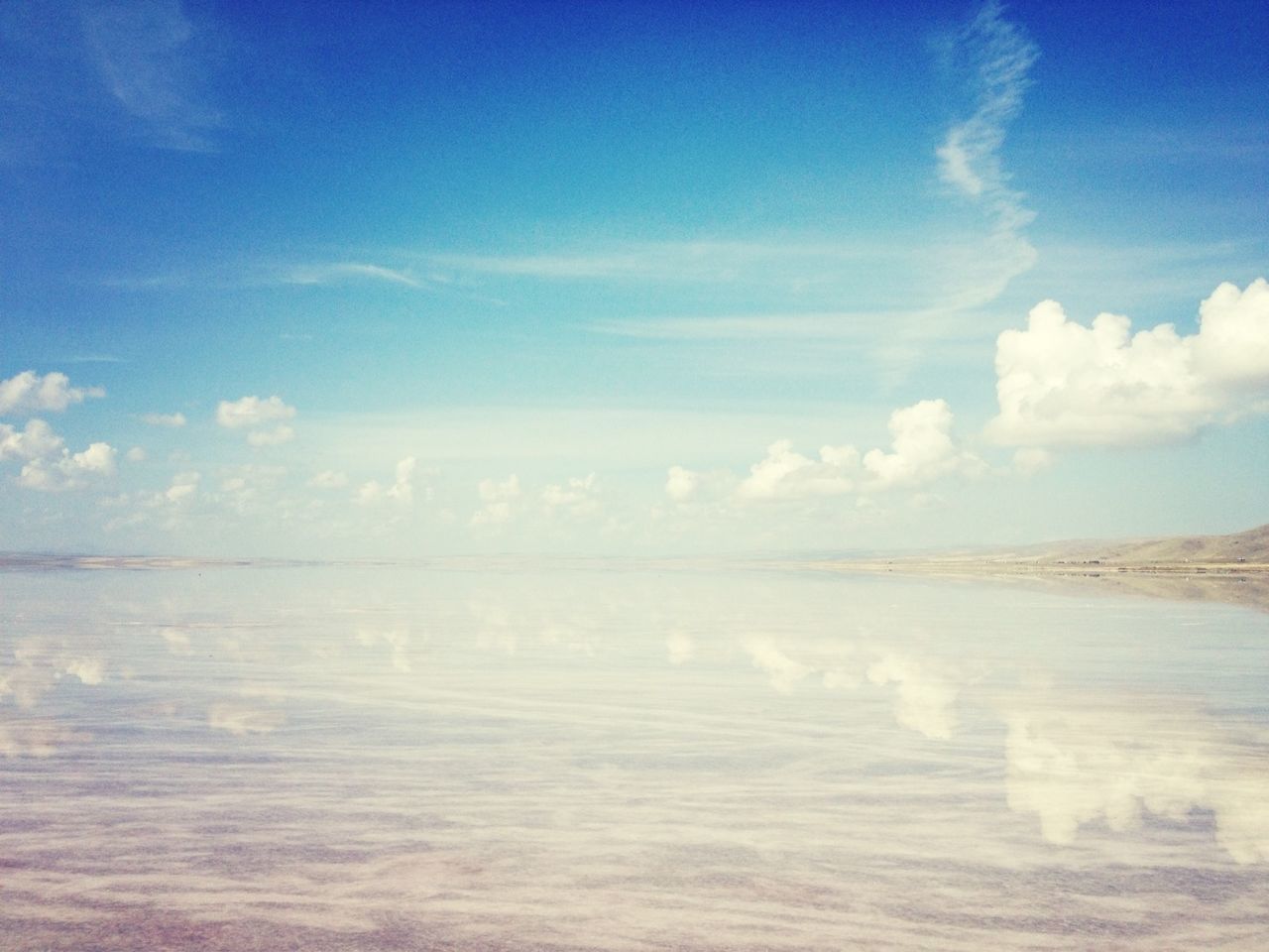 tranquil scene, tranquility, scenics, blue, sky, beauty in nature, water, nature, sea, waterfront, cloud - sky, idyllic, cloud, beach, day, outdoors, horizon over water, non-urban scene, remote, no people