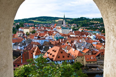 St vitus cathedral in city seen through window of cesky krumlov castle