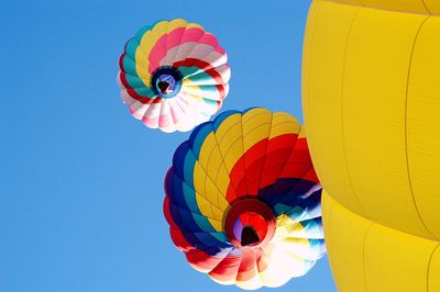 Low angle view of hot air balloons against sky