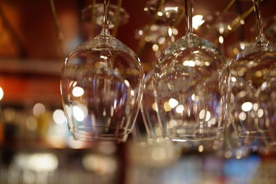 Close-up of wine glasses on table