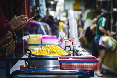 Person for sale at market stall