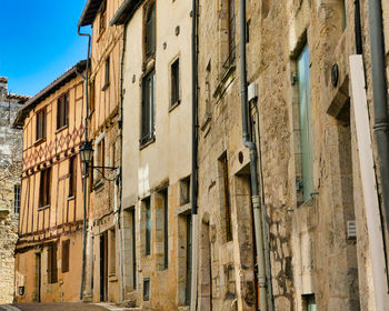 Low angle view of old buildings against sky