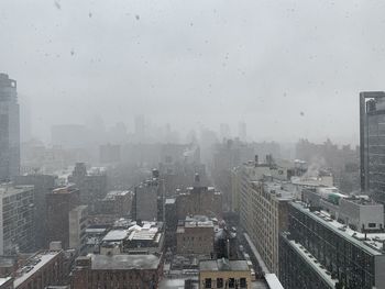 Aerial view of city buildings during rainy season