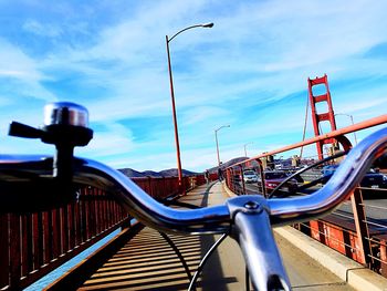 Cars on railing against sky