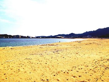 Scenic view of sea against blue sky
