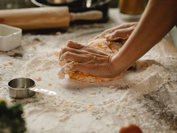 Cropped hand of person preparing food