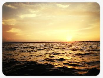 Scenic view of sea at sunset