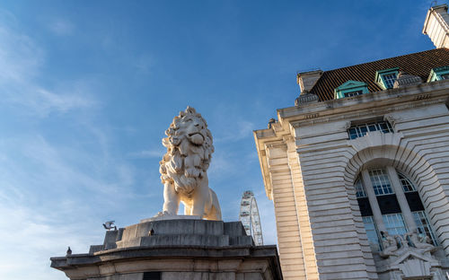 Low angle view of statue against sky