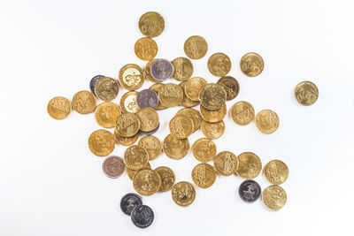 Close-up of coins on white background