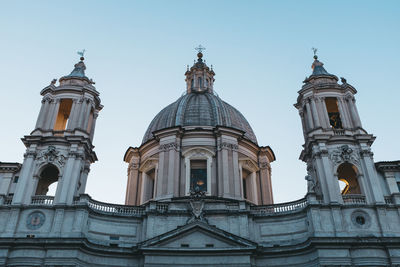 Low angle view of cathedral at piazza navona against clear sky