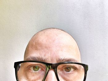 Close-up portrait of man wearing eyeglasses