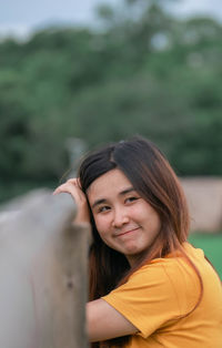 Portrait of young woman looking away