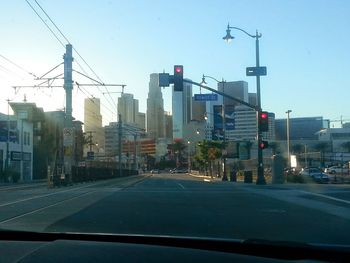 City street seen through car windshield