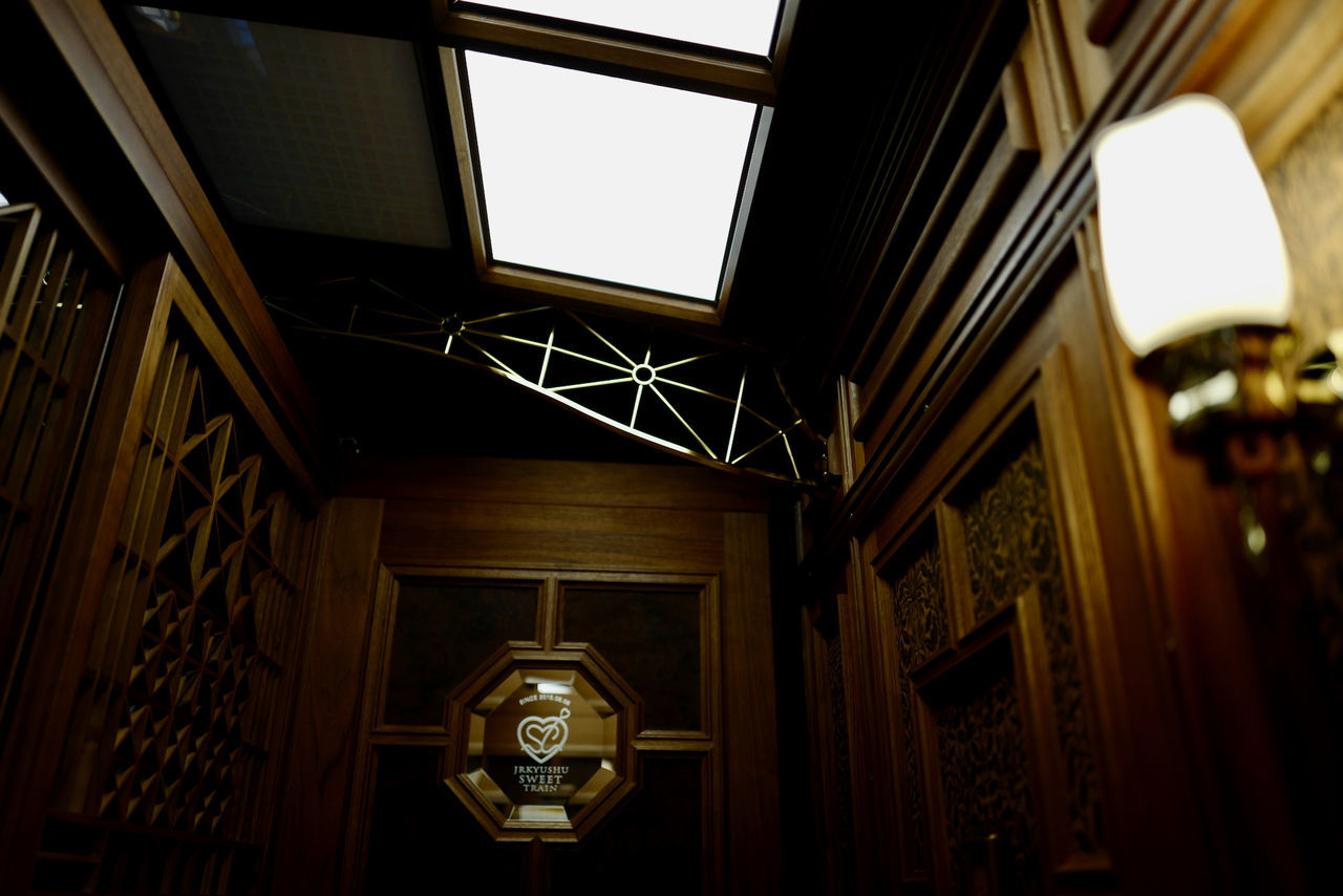 architecture, low angle view, indoors, built structure, no people, hanging, day, illuminated, building exterior, close-up, sky