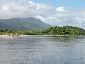 Scenic view of mountains against cloudy sky