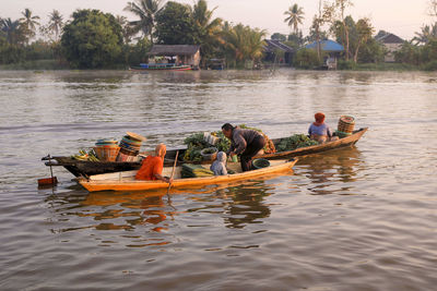 People on boat in lake