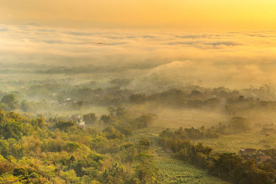 Scenic view of landscape against sky during sunset