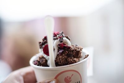 Close-up of hand holding ice cream