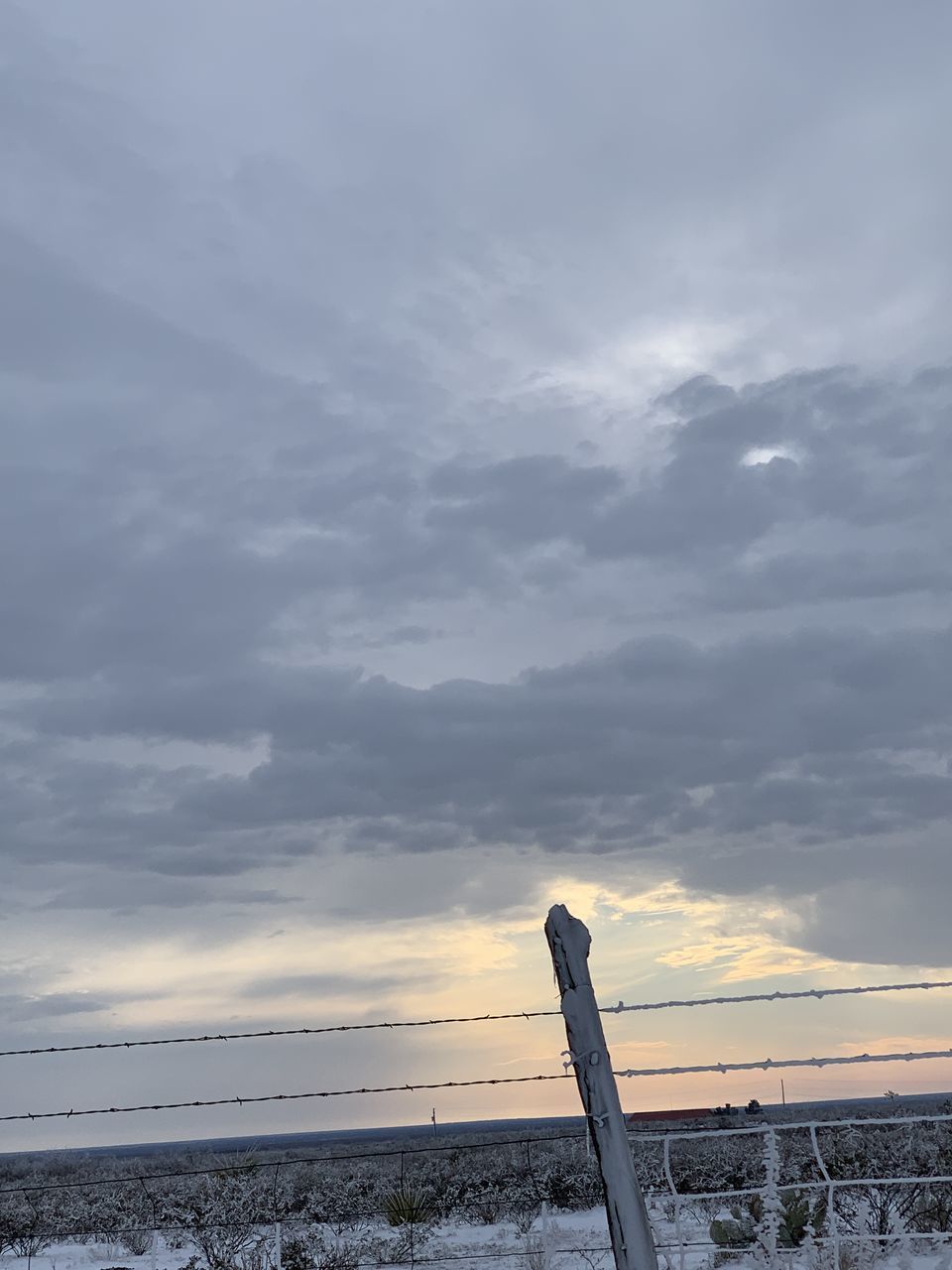 RAILING BY SEA AGAINST SKY DURING SUNSET