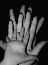 Close-up of hand holding over white background