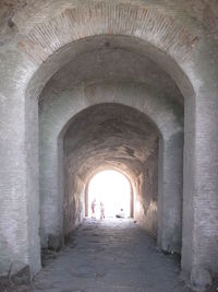 People walking in tunnel