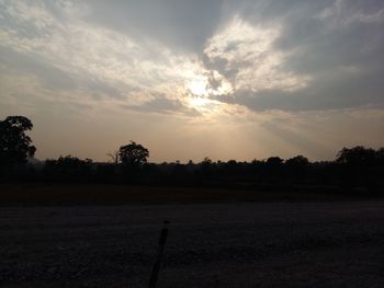 Scenic view of landscape against sky at sunset