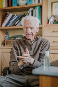 Man sitting on chair at table